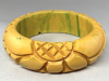 BB326 chunky butter yellow/inkspot flower carved bakelite bangle